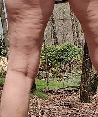 Granny pissing in forest